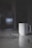 a white cup sitting on top of a marble counter