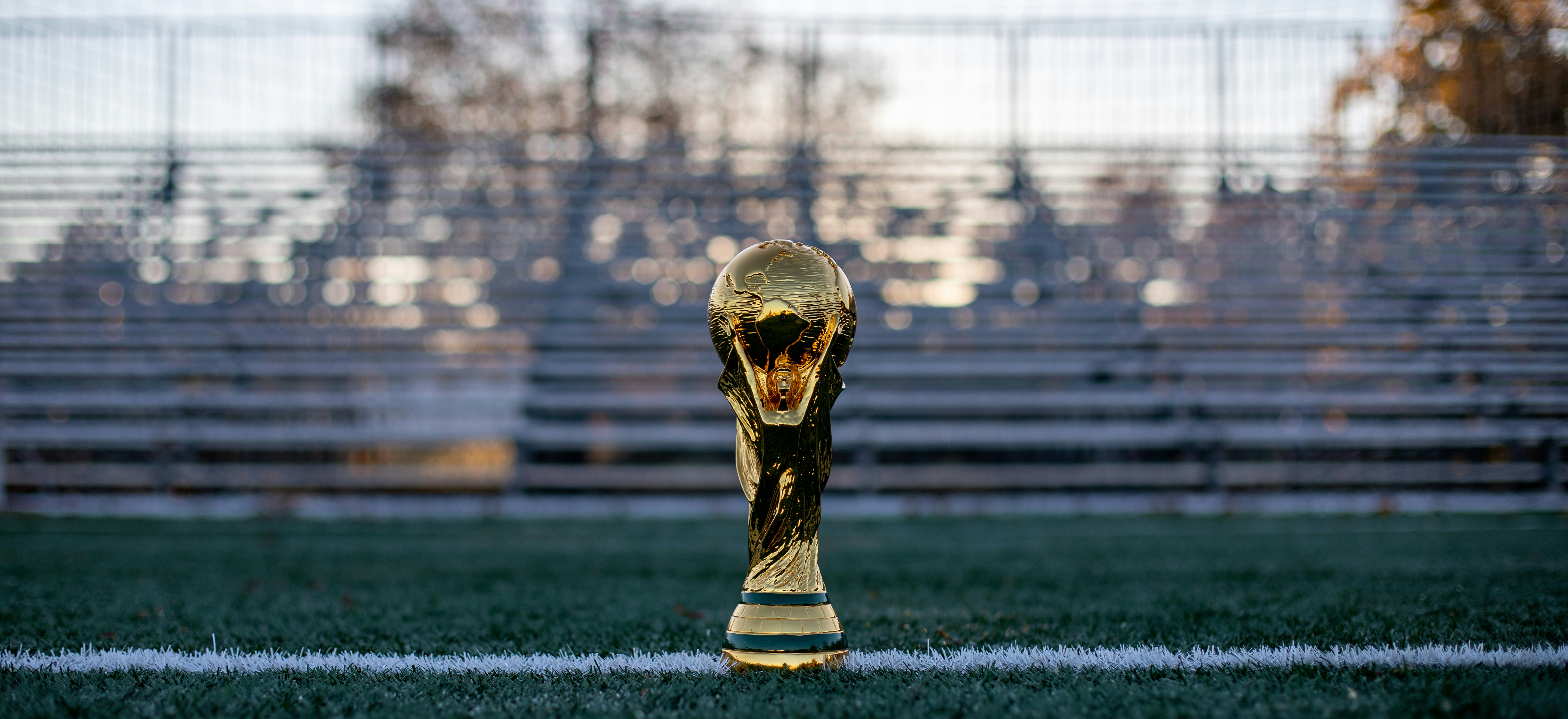 2022 world cup trophy with the bleachers in the background