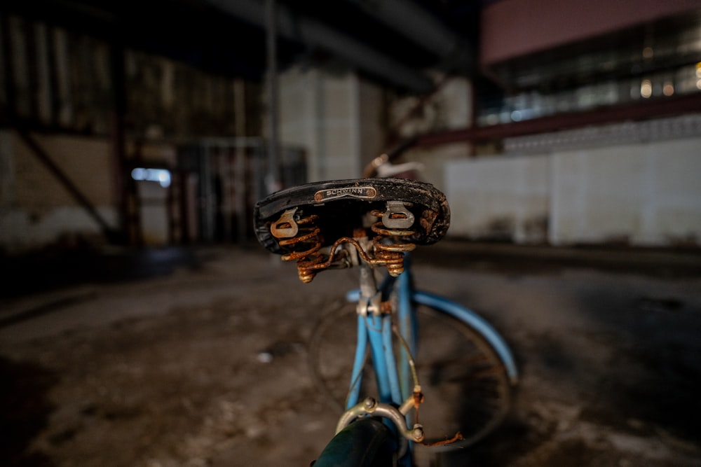 a close up of a bike with a broken seat