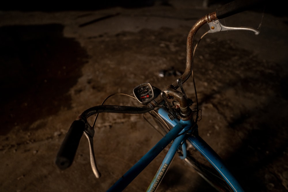 a close up of a bike handlebar with a blurry background