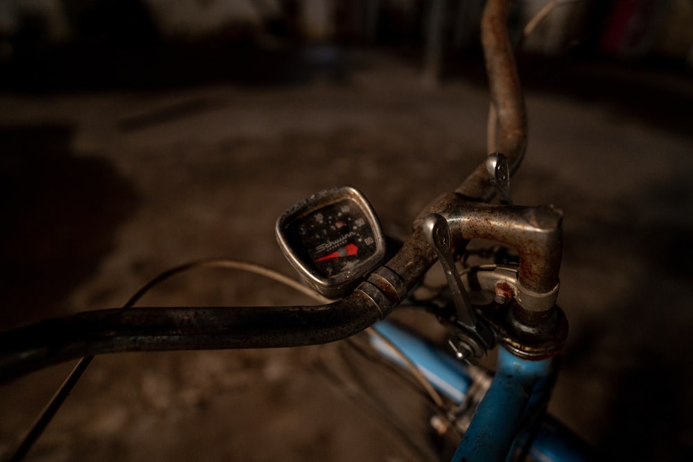 a close up of a bike handlebar with a meter