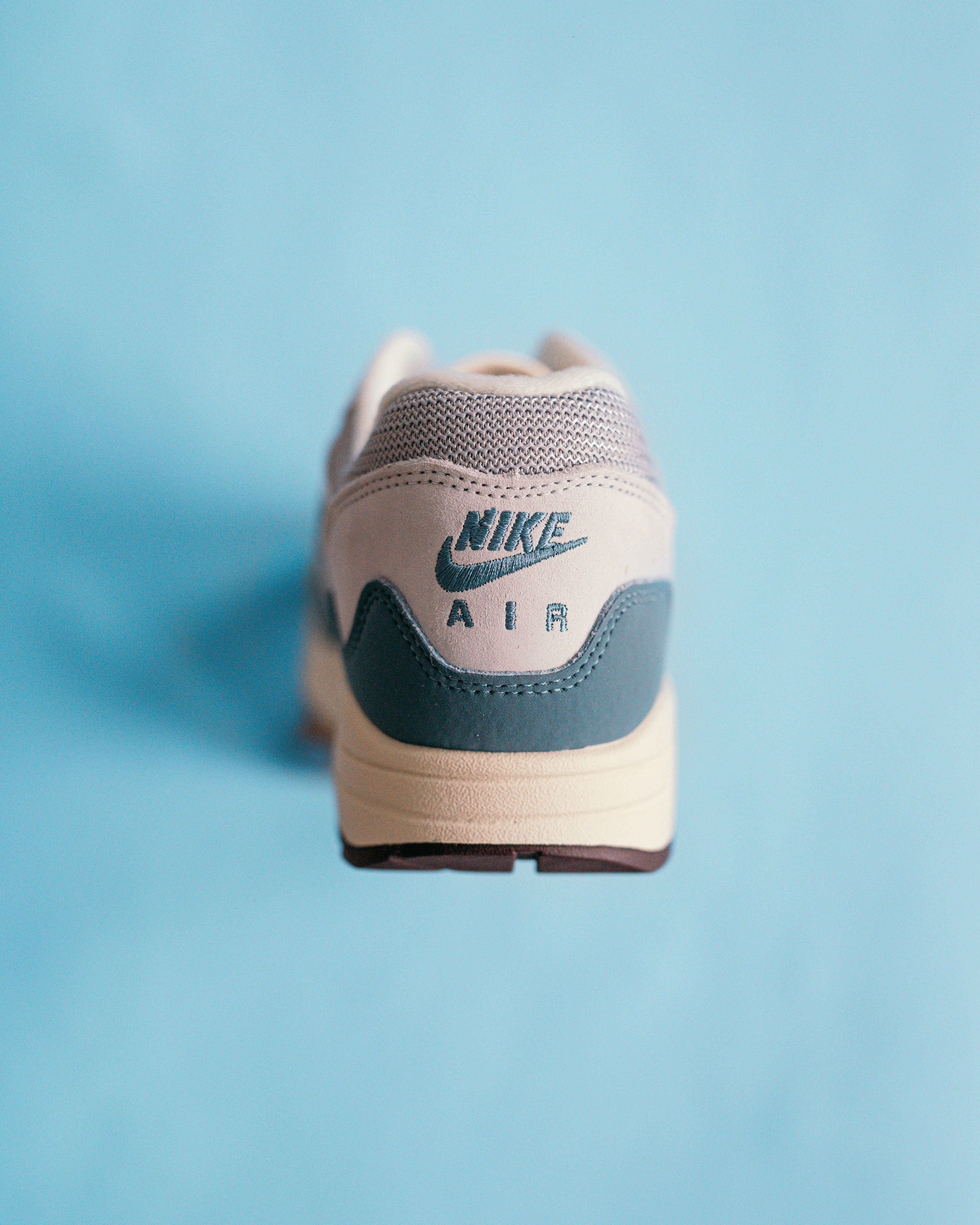 Nike sneaker heel and ankle collar detail with Nike Air branding on dark background