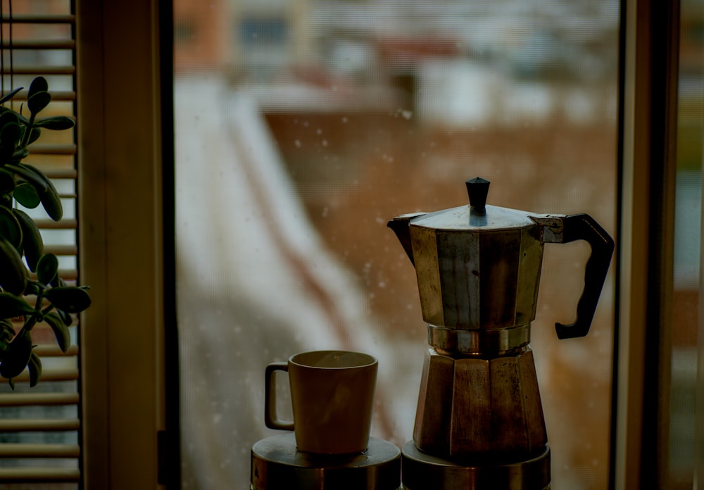 a stove top coffee maker sitting on top of a counter