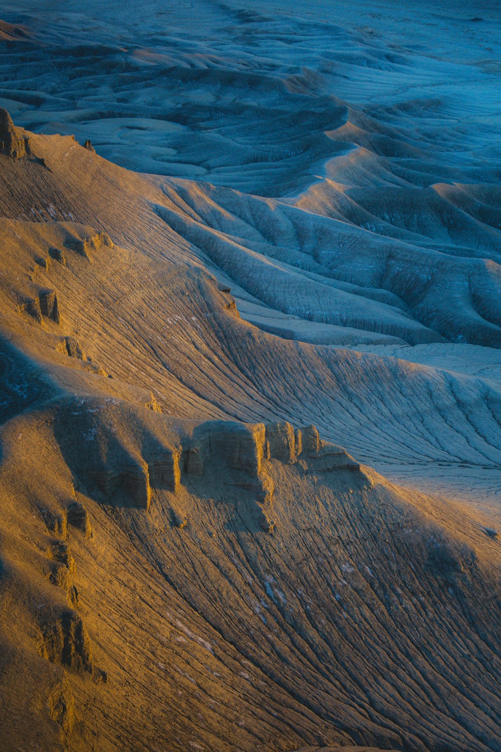 a view of the sand and water from an airplane