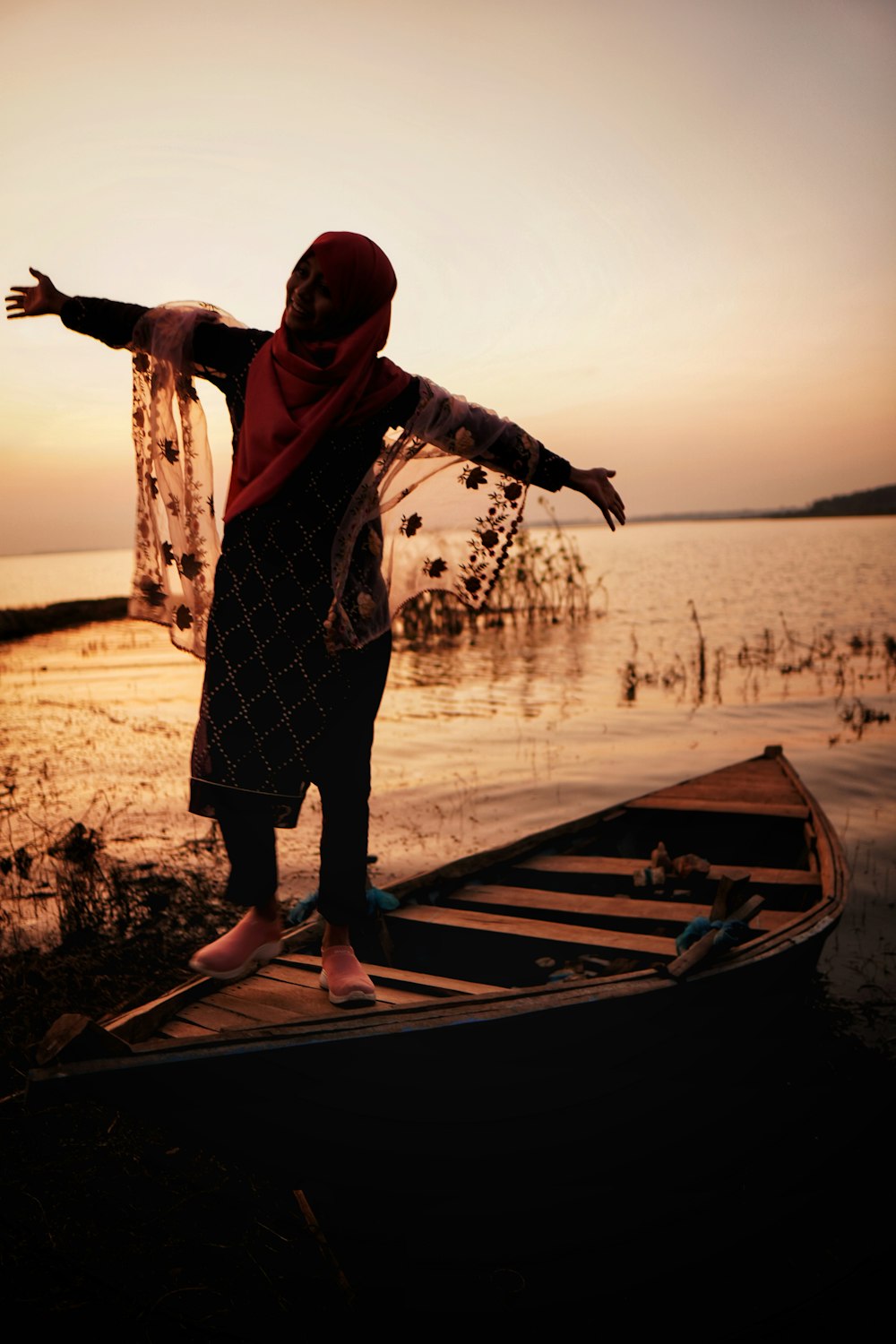 a person standing on a boat in the water