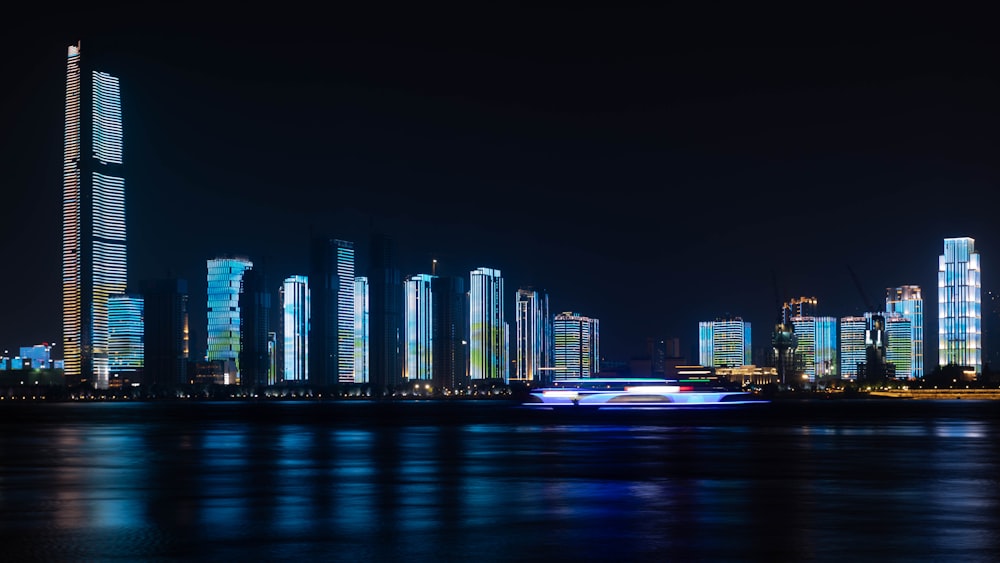 a large body of water with a city in the background