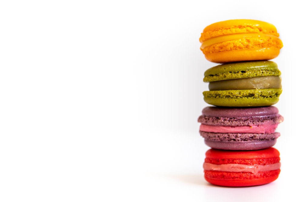 a stack of colorful macaroons sitting on top of each other