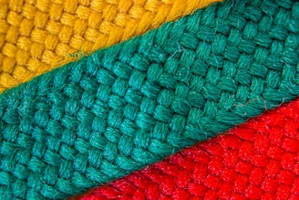 Close-up of colorful woven tapestry fabric showcasing intricate patterns.
