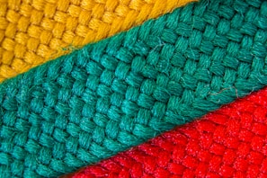 Close-up of handmade textiles with intricate Mexican patterns and vibrant colors.