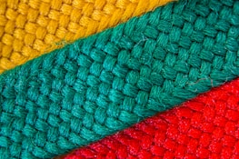 Close-up of colorful fabric patterns used in personalized awnings.