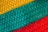 A close-up of a vibrant fabric swatch showcasing intricate patterns and textures.