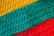 A close-up of a vibrant fabric swatch showcasing intricate patterns and textures.