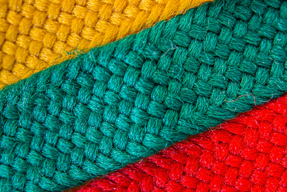Close-up of vibrant African fabric patterns with intricate stitching details