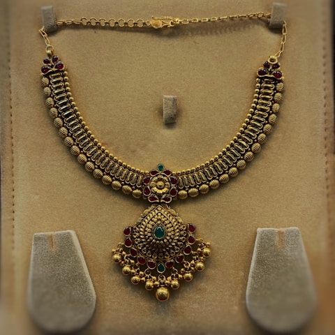 A beautifully crafted gold and diamond necklace showcasing traditional artistry.