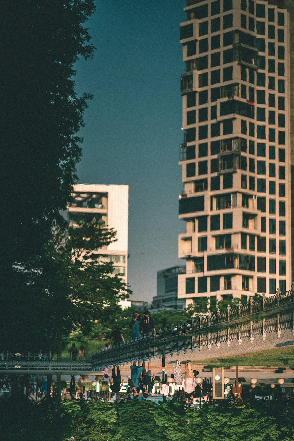 a group of people standing in front of a tall building