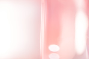 Elegant composition of subtle textures blending pink and grey shades in natural light.