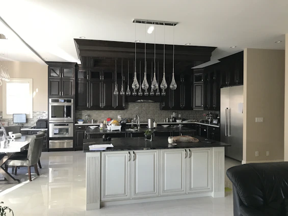 a black and white kitchen with lots of counter space