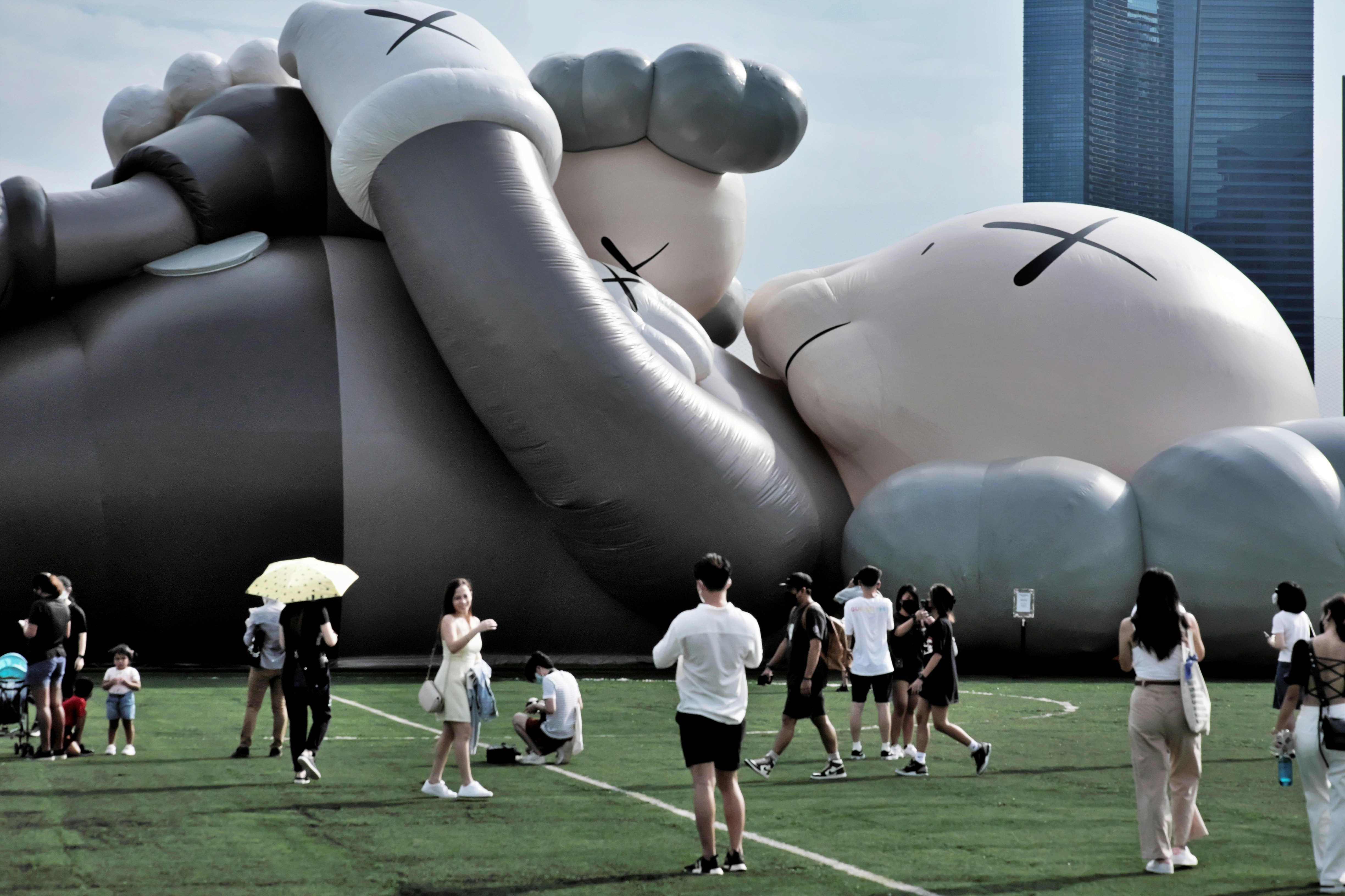 a group of people standing in front of a large balloon