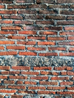 a close up of a red brick wall