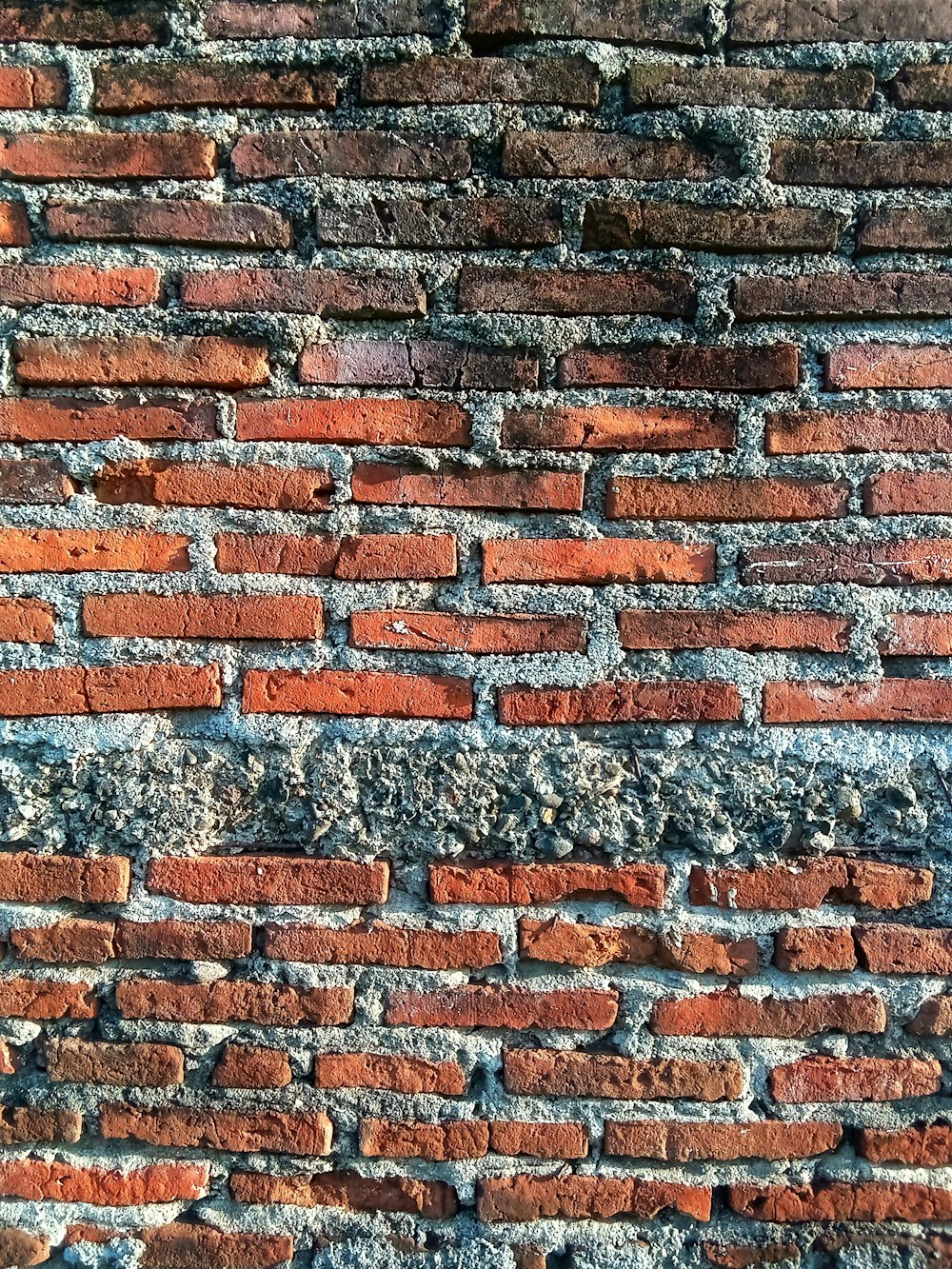 a close up of a red brick wall