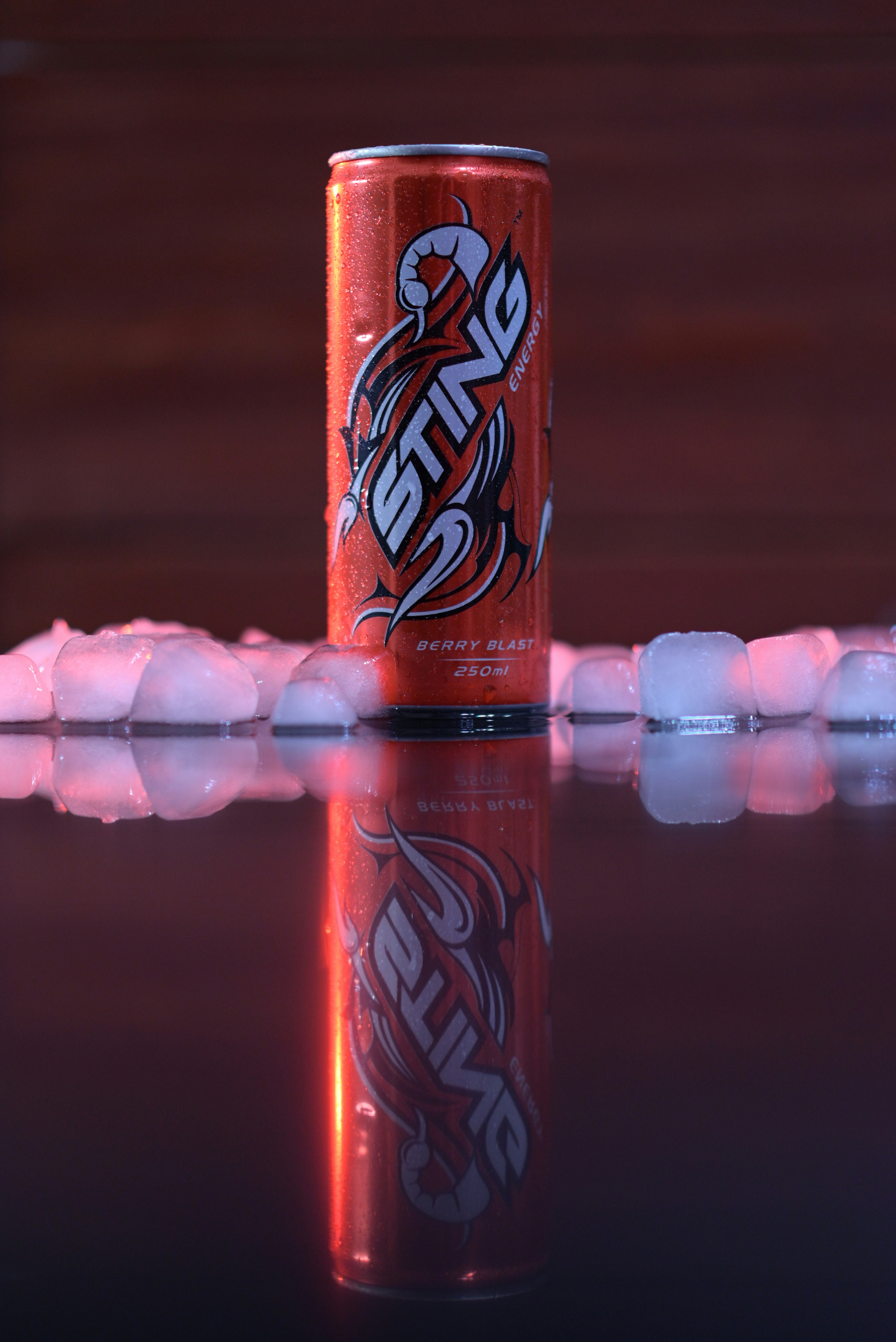 a can of soda sitting on top of a table