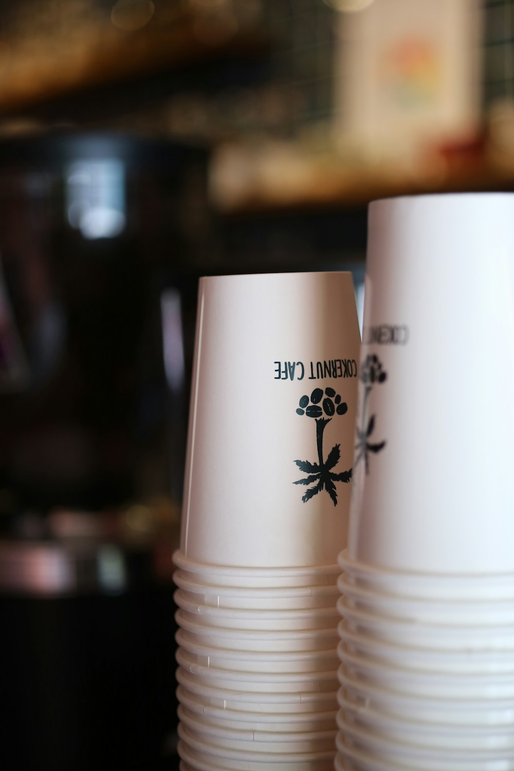 a couple of white cups sitting on top of a table