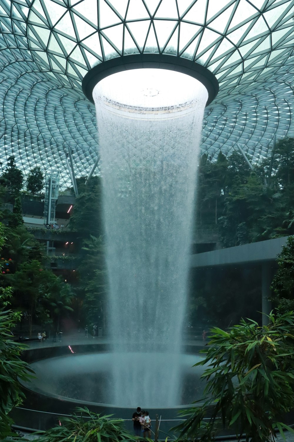 a large waterfall in the middle of a building