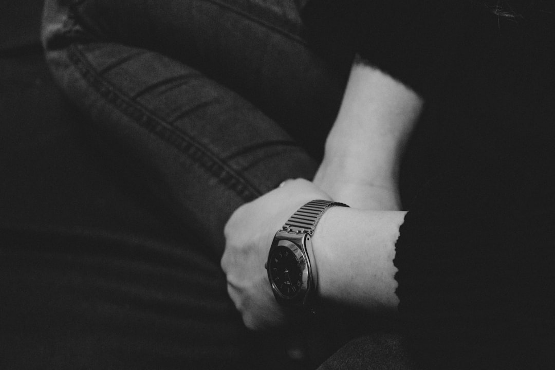 a person with a watch on their wrist,