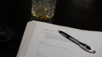 a pen sitting on top of a piece of paper