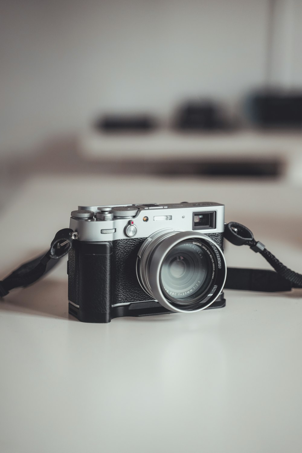 a camera sitting on top of a white table