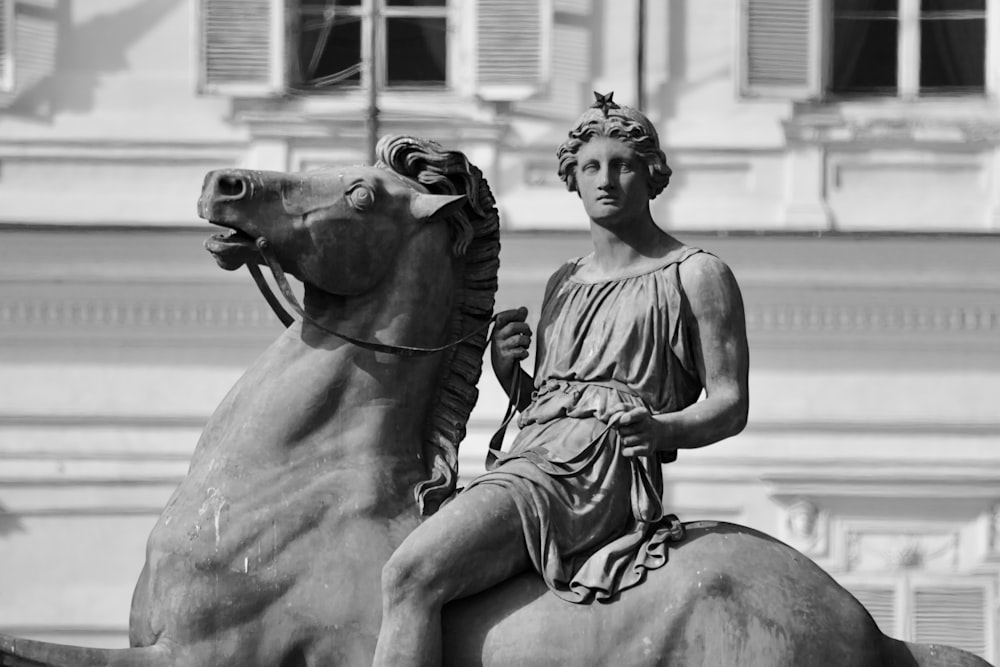 a statue of a woman riding a horse