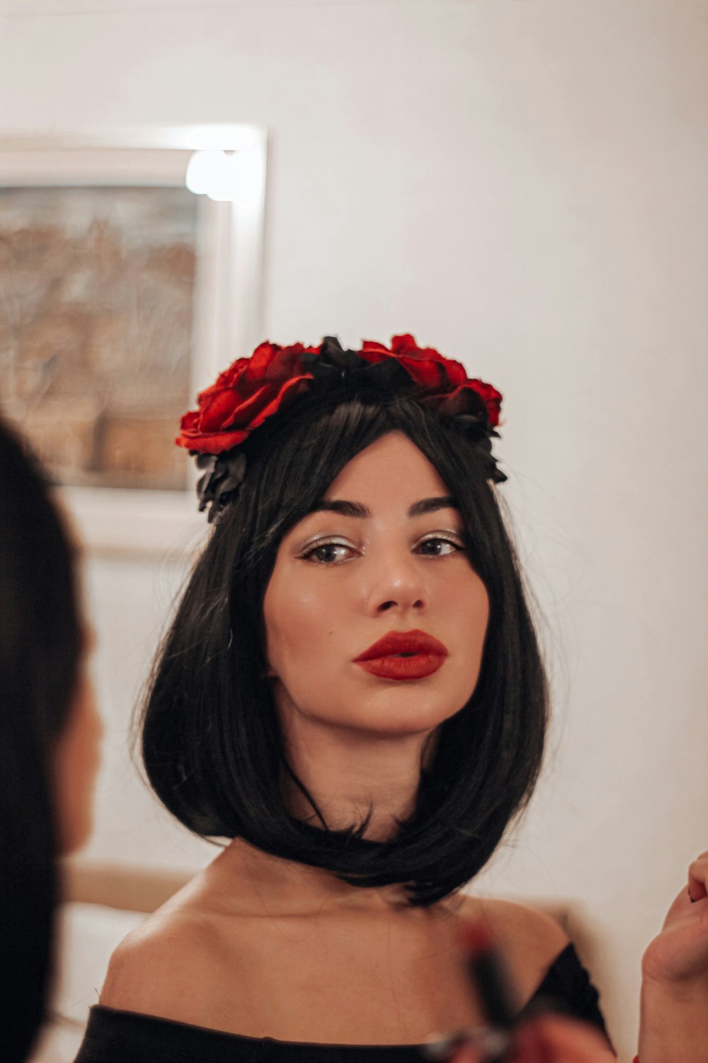 a woman with a flower in her hair