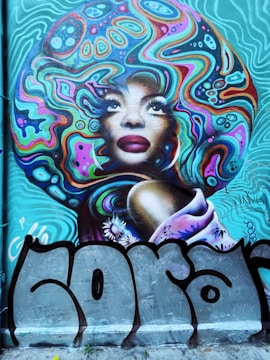 A passionate African artist painting a mural that celebrates cultural identity