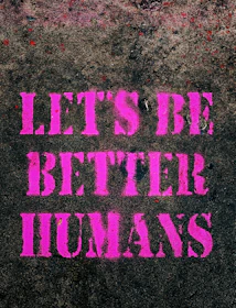 the words let's be better humans are painted on the sidewalk