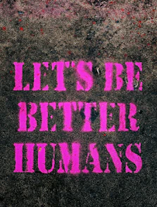 the words let's be better humans are painted on the sidewalk