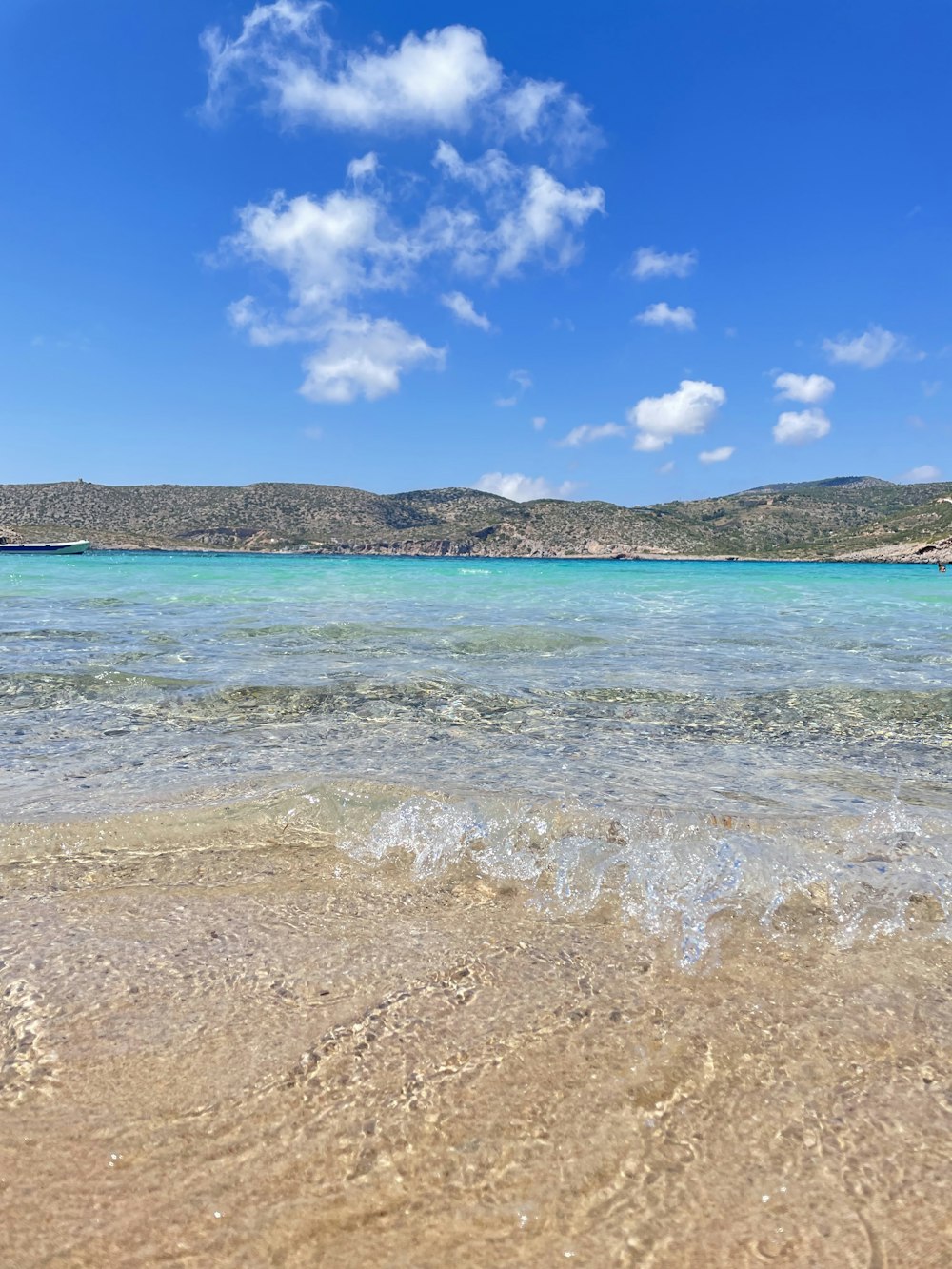 a view of the ocean from the shore of a beach