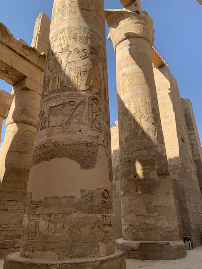 A close-up of weathered Egyptian megaliths bathed in golden sunlight, hinting at hidden stories.