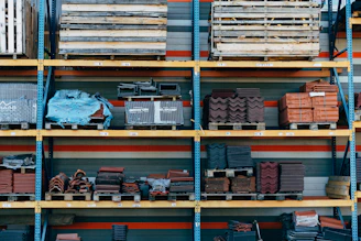 a shelf filled with lots of different types of bricks