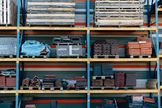 a shelf filled with lots of different types of bricks