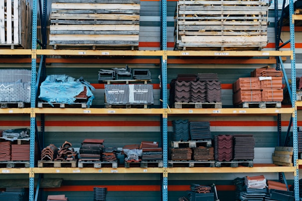 a shelf filled with lots of different types of bricks