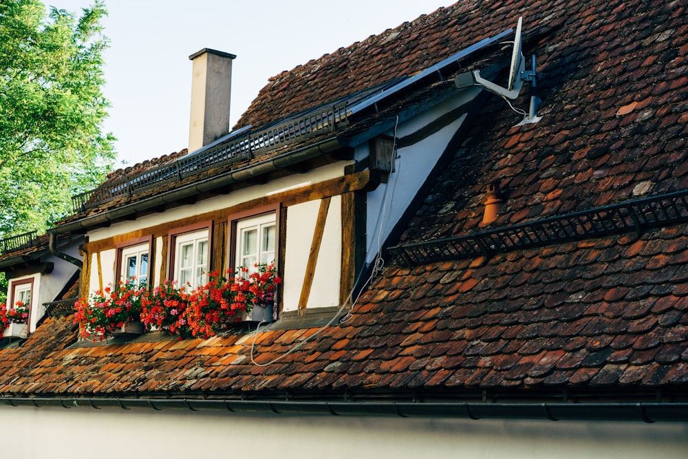 a building with flowers on the windows