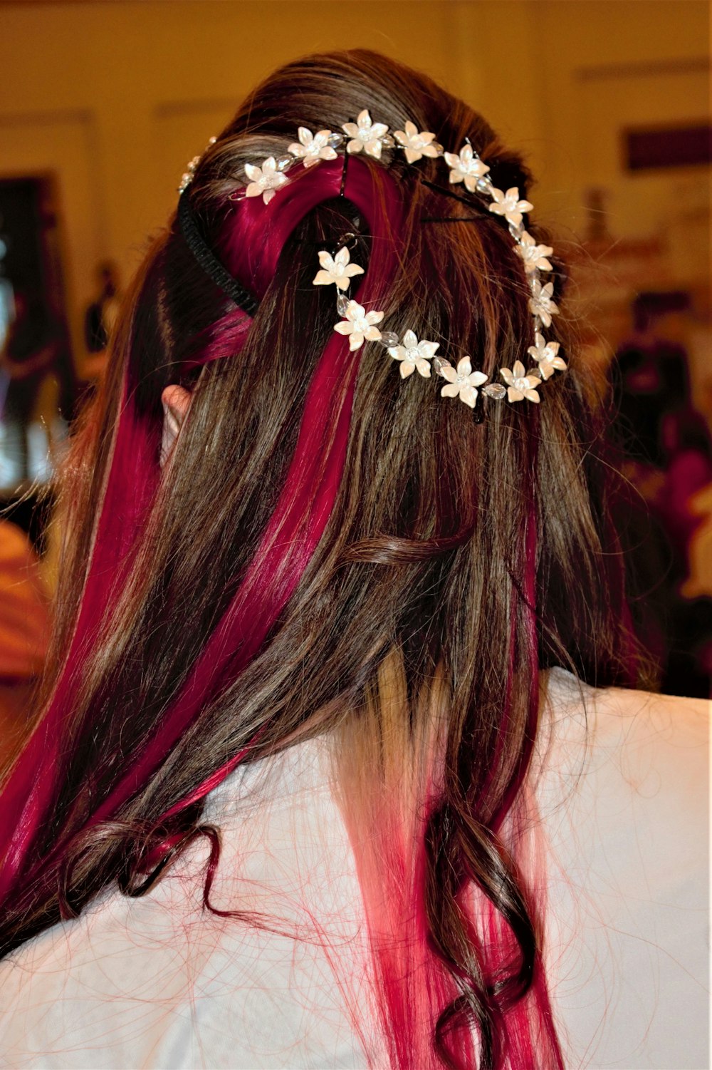 a woman with long hair with flowers in her hair