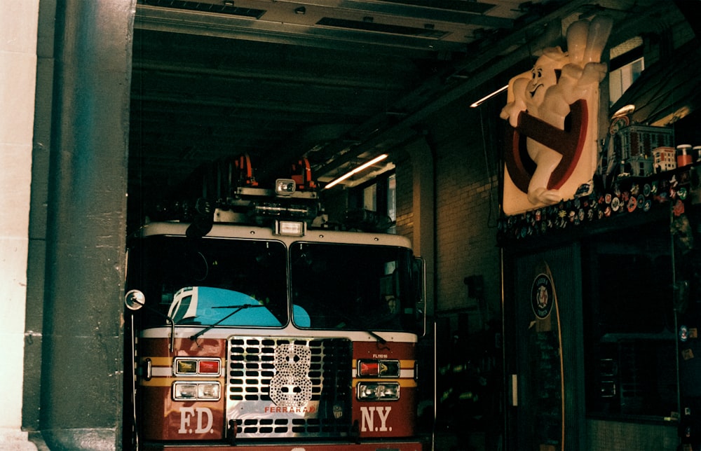 a fire truck parked inside of a garage