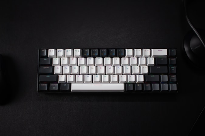 Keyboard and mouse on a dark surface workspace setup
