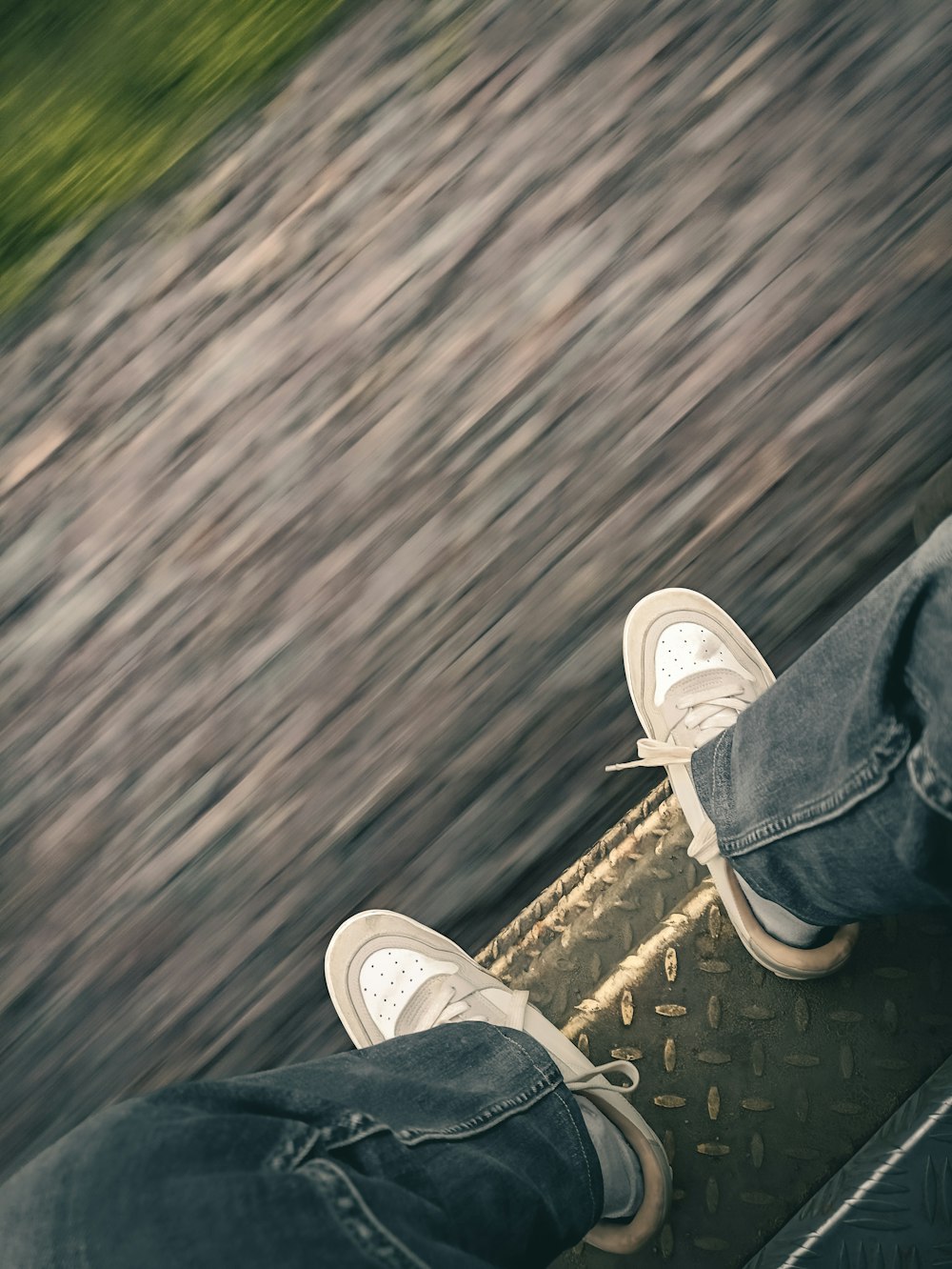 a person riding a skateboard down a street