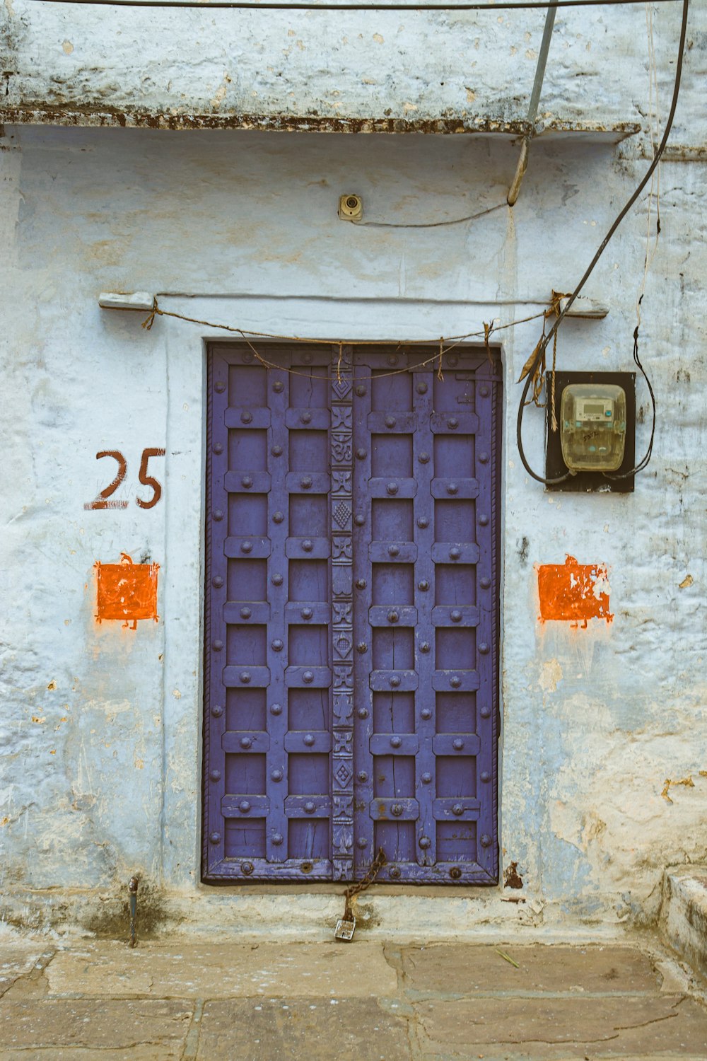 a blue door with numbers painted on it