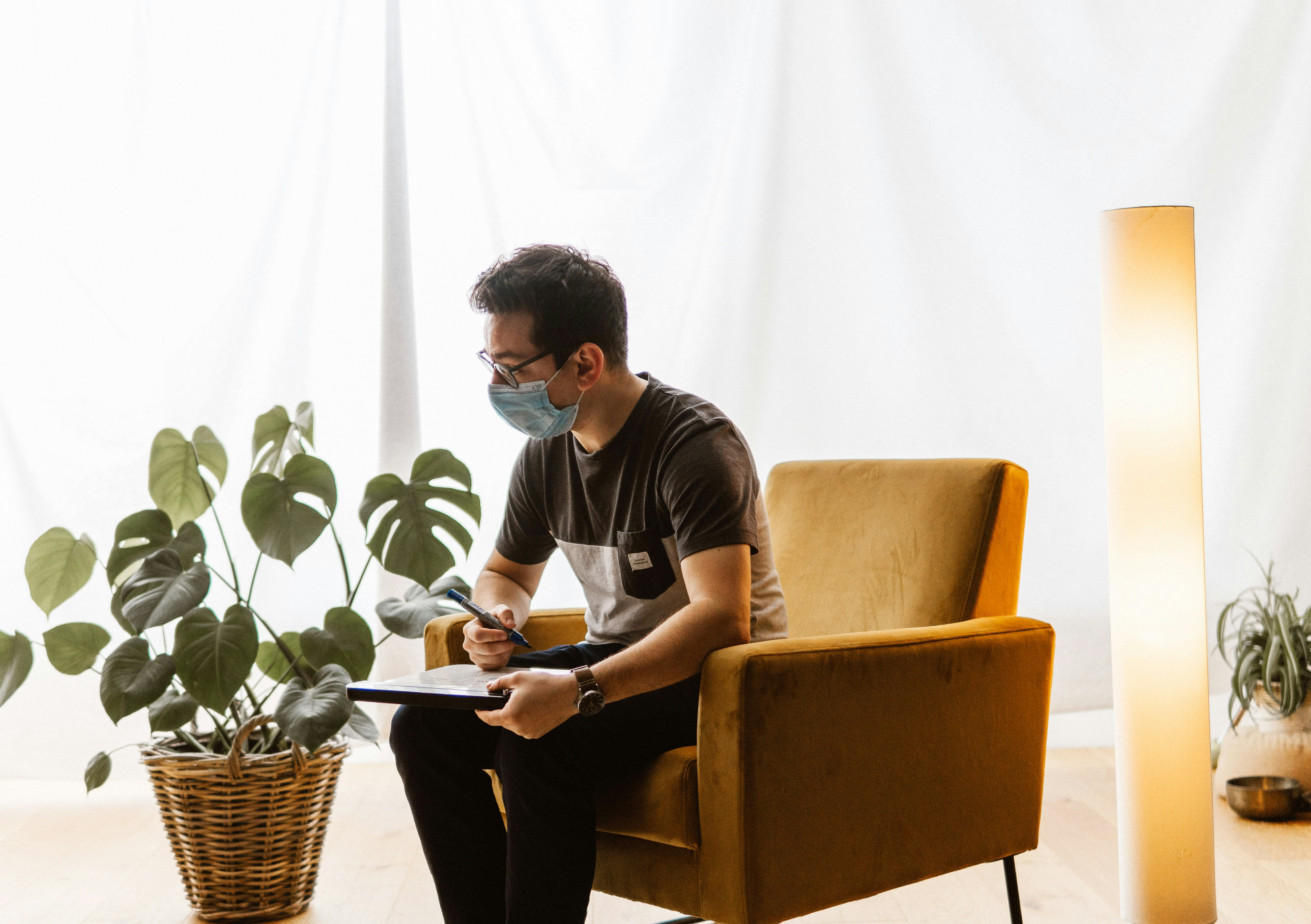 Camera assistant writing on a film slate.