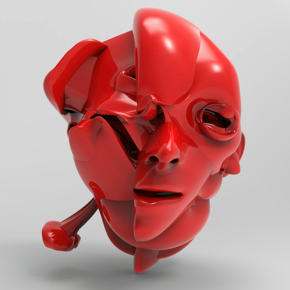 uma cabeça humana vermelha com olhos e um nariz