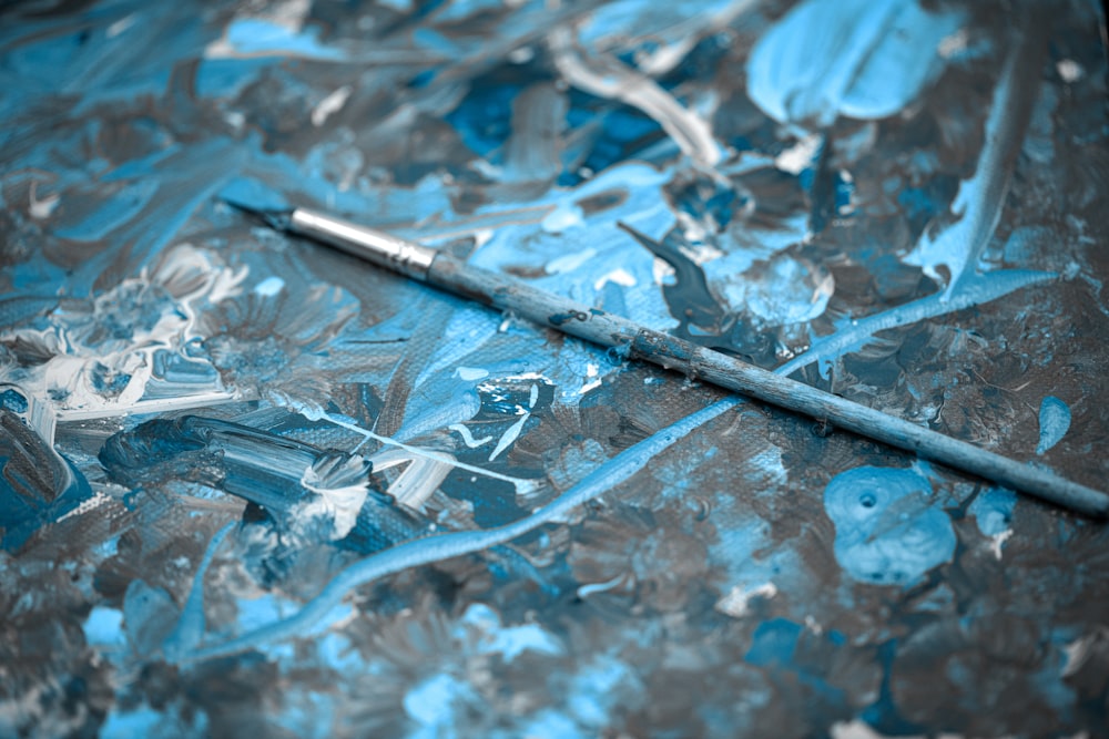 a close up of a painting with a brush