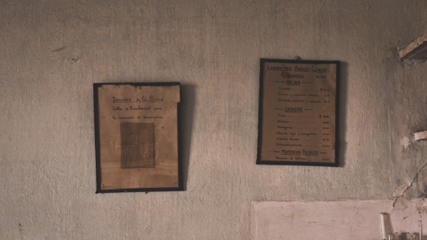 Historic framed documents and photographs displayed on the lodge’s heritage wall.